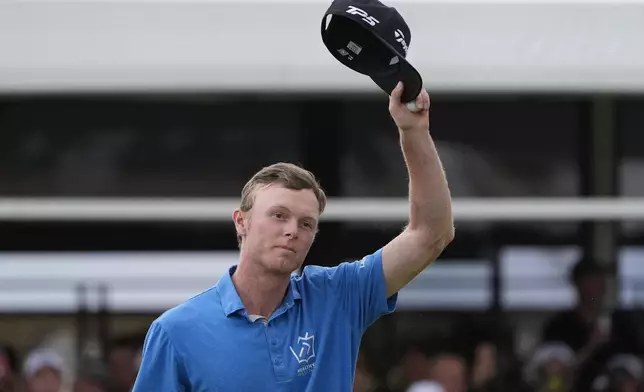 Ryggs Johnston of the United States reacts after winning the Australian Open golf championship at the Kingston Heath Golf Club in Melbourne, Australia, Sunday, Dec. 1, 2024. (AP Photo/Asanka Brendon Ratnayake)