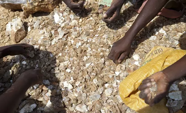 Juliet Samaniya, 6, works with other children at an illegal lithium mining site in Paseli, Nigeria, Tuesday, Nov 5, 2024. (AP Photo/Sunday Alamba)