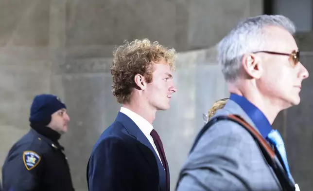 Daniel Penny, center, arrives at court, Wednesday, Dec. 4, 2024, in New York. (AP Photo/Heather Khalifa)