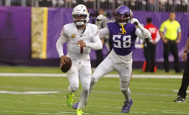 Arizona Cardinals quarterback Kyler Murray (1) runs from Minnesota Vikings linebacker Jonathan Greenard (58) during the first half of an NFL football game Sunday, Dec. 1, 2024, in Minneapolis. (AP Photo/Bruce Kluckhohn)