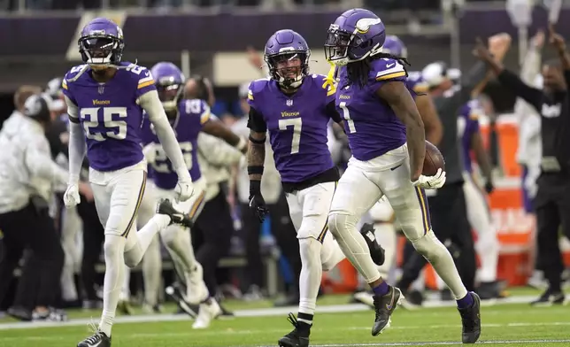 Minnesota Vikings cornerback Shaquill Griffin (1) celebrates after intercepting a pass during the second half of an NFL football game against the Arizona Cardinals Sunday, Dec. 1, 2024, in Minneapolis. (AP Photo/Abbie Parr)