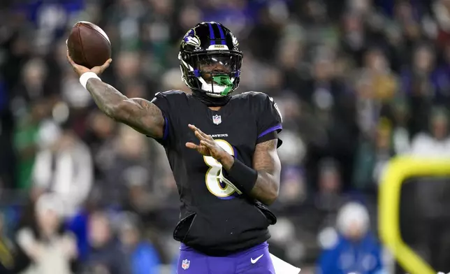 Baltimore Ravens quarterback Lamar Jackson throws a pass against the Philadelphia Eagles during the first half of an NFL football game, Sunday, Dec. 1, 2024, in Baltimore. (AP Photo/Nick Wass)