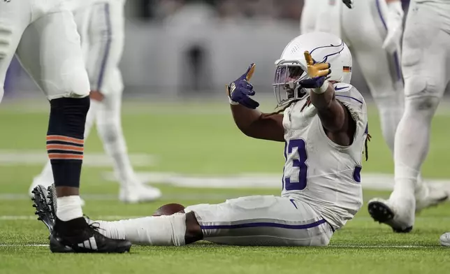 Minnesota Vikings running back Aaron Jones (33) reacts after running for a first down during the second half of an NFL football game against the Chicago Bears, Monday, Dec. 16, 2024, in Minneapolis. (AP Photo/Abbie Parr)