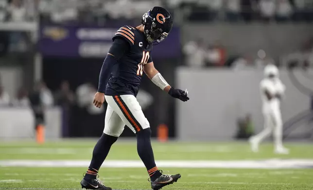 Chicago Bears quarterback Caleb Williams walks off the field after an incomplete third down pass during the first half of an NFL football game against the Minnesota Vikings, Monday, Dec. 16, 2024, in Minneapolis. (AP Photo/Abbie Parr)