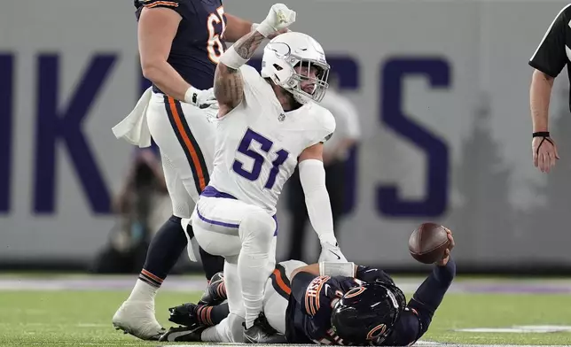 Minnesota Vikings linebacker Blake Cashman (51) celebrates a defensive stop during the first half of an NFL football game against the Chicago Bears, Monday, Dec. 16, 2024, in Minneapolis. (AP Photo/Abbie Parr)