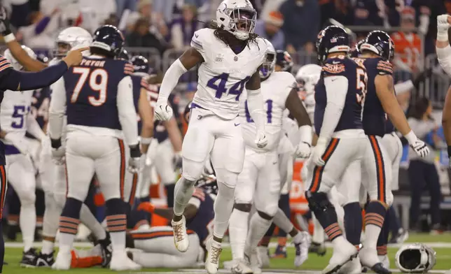 Minnesota Vikings safety Josh Metellus (44) celebrates a defensive stop during the first half of an NFL football game against the Chicago Bears, Monday, Dec. 16, 2024, in Minneapolis. (AP Photo/Bruce Kluckhohn)