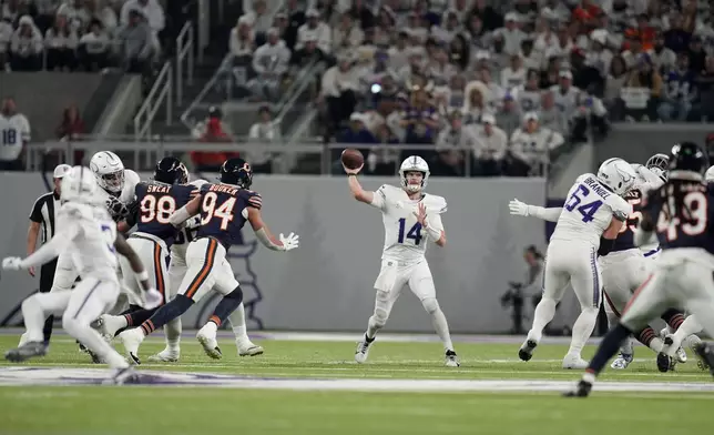 Minnesota Vikings quarterback Sam Darnold (14) throws a pass during the first half of an NFL football game against the Chicago Bears, Monday, Dec. 16, 2024, in Minneapolis. (AP Photo/Abbie Parr)