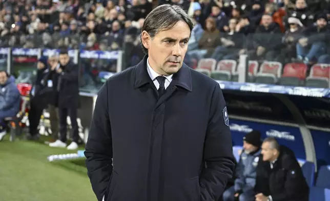 Inter Milan's coach Simone Inzaghi waits for the start of the Serie A soccer match between Cagliari Calcio and Inter Milan at the Unipol Domus stadium in Cagliari, Italy, Saturday, Dec. 28, 2024. (Gianluca Zuddas/LaPresse via AP)