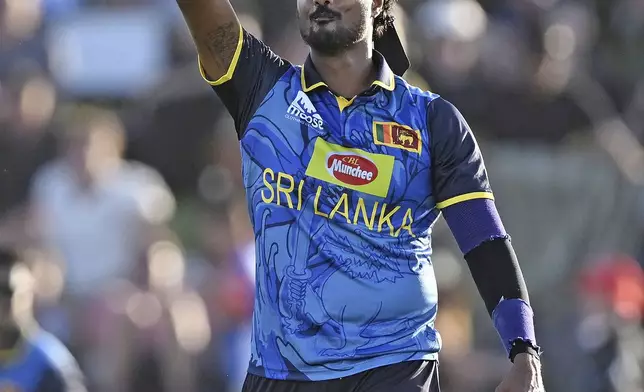 Sri Lanka's Avishka Fernando celebrates the wicket of New Zealand's Tim Robinson during the first Twenty20 international cricket match between New Zealand and Sri Lanka at Mt Maunganui, New Zealand on Saturday, Dec. 28, 2024. (Andrew Cornaga/Photosport via AP)