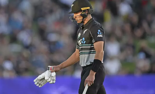 New Zealand's Mitchell Hay leaves the field after being dismissed by Sri Lanka's Wanindu Hasaranga during the first Twenty20 international cricket match between New Zealand and Sri Lanka at Mt Maunganui, New Zealand on Saturday, Dec. 28, 2024. (Andrew Cornaga/Photosport via AP)