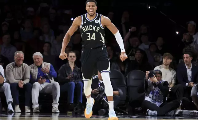 Milwaukee Bucks forward Giannis Antetokounmpo (34) celebrates after making a basket during the first half of a semifinal game against the Atlanta Hawks in the NBA Cup basketball tournament Saturday, Dec. 14, 2024, in Las Vegas. (AP Photo/Ian Maule)