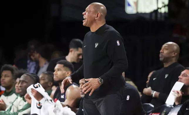 Milwaukee Bucks head coach Doc Rivers, center, yells during the first half of a semifinal game against the Atlanta Hawks in the NBA Cup basketball tournament Saturday, Dec. 14, 2024, in Las Vegas. (AP Photo/Ian Maule)