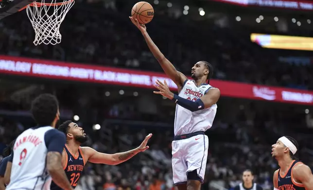 Washington Wizards forward Alexandre Sarr goes to the basket for a lay up during the first half of an NBA basketball game against the New York Knicks, Monday, Dec. 30, 2024, in Washington. (AP Photo/Terrance Williams)