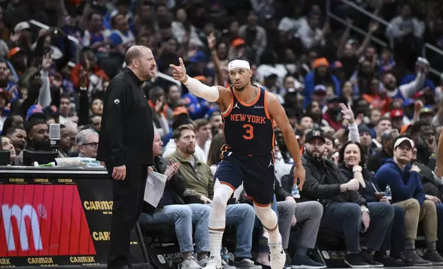 New York Knicks guard Josh Hart (3) gestures after making a three point basket during the first half of an NBA basketball game against the Washington Wizards, Monday, Dec. 30, 2024, in Washington. (AP Photo/Terrance Williams)