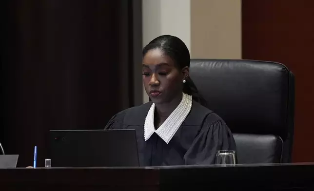 Michigan Supreme Court Justice Kyra Harris Bolden listens to oral arguments at the Michigan Hall of Justice, Wednesday, Dec. 4, 2024, in Lansing, Mich. (AP Photo/Carlos Osorio)