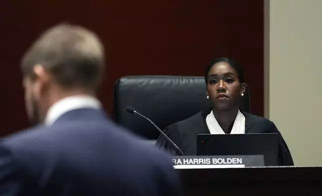 Michigan Supreme Court Justice Kyra Harris Bolden listens to oral arguments at the Michigan Hall of Justice, Wednesday, Dec. 4, 2024, in Lansing, Mich. (AP Photo/Carlos Osorio)