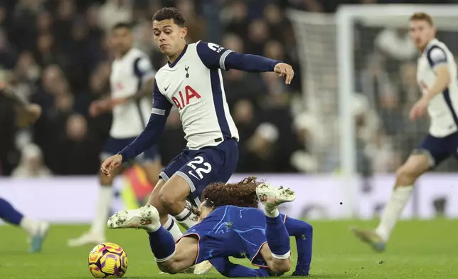 Tottenham's Brennan Johnson challenges for the ball with Chelsea's Marc Cucurella during the English Premier League soccer match between Tottenham Chelsea, at the Hotspur stadium in London, Sunday, Dec.8, 2024. (AP Photo/Ian Walton)