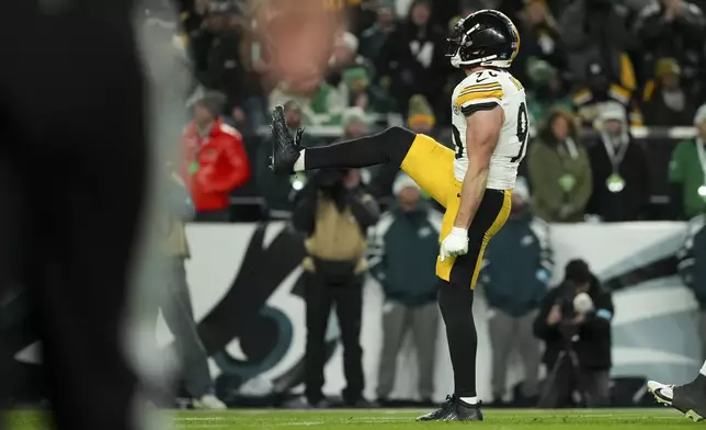 Pittsburgh Steelers linebacker T.J. Watt reacts after sacking Philadelphia Eagles quarterback Jalen Hurts (1) during the first half of an NFL football game Sunday, Dec. 15, 2024, in Philadelphia. (AP Photo/Matt Slocum)