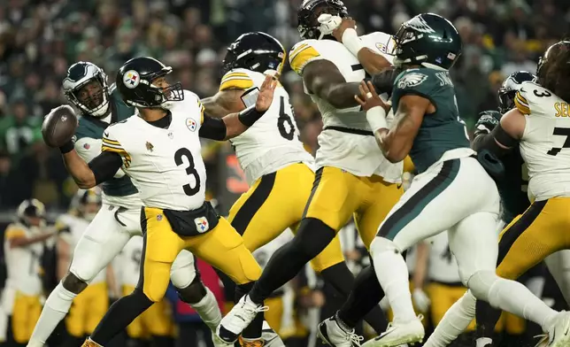 Pittsburgh Steelers quarterback Russell Wilson (3) looks to pass during the first half of an NFL football game against the Philadelphia Eagles on Sunday, Dec. 15, 2024, in Philadelphia. (AP Photo/Matt Slocum)