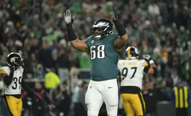 Philadelphia Eagles offensive tackle Jordan Mailata (68) reacts after a touchdown by Eagles wide receiver A.J. Brown during the first half of an NFL football game against the Pittsburgh Steelers on Sunday, Dec. 15, 2024, in Philadelphia. (AP Photo/Matt Slocum)