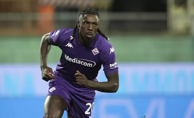 Fiorentina's Moise Kean celebrates after scoring his side's first goal during the Italian Serie A soccer match between Fiorentina and Udinese, Artemio Franchi Stadium in Florence, Italy, Monday Dec. 23, 2024 (Massimo Paolone/LaPresse via AP)