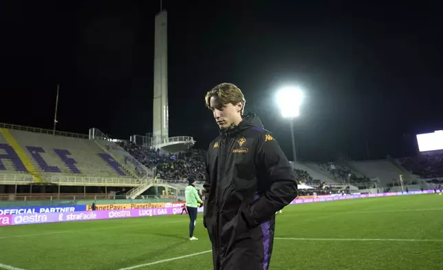 Fiorentina's Edoardo Bove walks on the pitch ahead of the Italian Serie A soccer match between Fiorentina and Udinese, Artemio Franchi Stadium in Florence, Italy, Monday Dec. 23, 2024 (Massimo Paolone/LaPresse via AP)