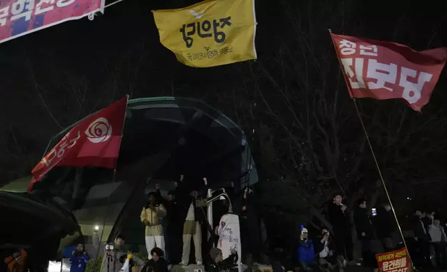 People gather in front of the National Assembly in Seoul, South Korea, Wednesday, Dec. 4, 2024. (AP Photo/Ahn Young-joon)