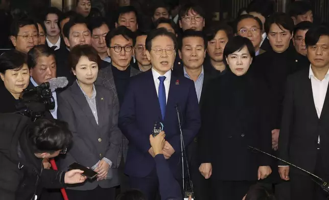 South Korea's main opposition Democratic Party leader Lee Jae-myung, center, speaks at the National Assembly in Seoul, South Korea, Wednesday, Dec. 4, 2024. (Kim Ju-hyung/Yonhap via AP)