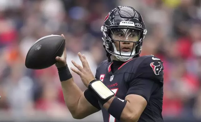 Houston Texans quarterback C.J. Stroud (7) looks to pass during the first half of an NFL football game against the Miami Dolphins, Sunday, Dec. 15, 2024, in Houston. (AP Photo/Eric Christian Smith)