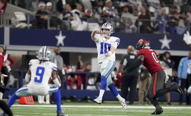 Dallas Cowboys quarterback Cooper Rush (10) throws a pass under pressure from Tampa Bay Buccaneers linebacker Yaya Diaby (0) in the second half of an NFL football game in Arlington, Texas, Sunday, Dec. 22, 2024. (AP Photo/Julio Cortez)