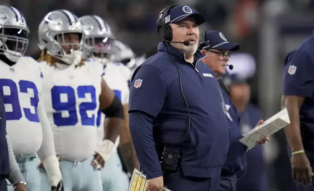 Dallas Cowboys head coach Mike McCarthy watches play against the Tampa Bay Buccaneers in the first half of an NFL football game in Arlington, Texas, Sunday, Dec. 22, 2024. (AP Photo/Julio Cortez)