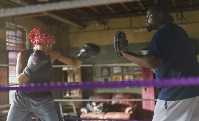 This image released by Amazon Content Services shows Ryan Destiny as Claressa Shields, left, and Brian Tyree Henry as Jason Crutchfield in a scene from "The Fire Inside." (Sabrina Lantos/Amazon Content Services via AP)