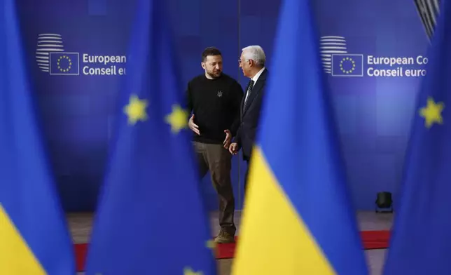 Ukraine's President Volodymyr Zelenskyy, left, speaks with European Council President Antonio Costa as they arrive for an EU summit at the European Council building in Brussels, Thursday, Dec. 19, 2024. (AP Photo/Geert Vanden Wijngaert)