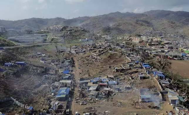 A drone view of the Barakani, Mayotte, informal settlement, Saturday, Dec. 21, 2024. (AP Photo/Adrienne Surprenant)