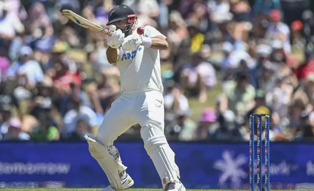 New Zealand's Daryl Mitchell bats during play on the fourth day of the first cricket test between England and New Zealand at Hagley Oval in Christchurch, New Zealand, Sunday, Dec. 1, 2024.(John Davidson/Photosport via AP)