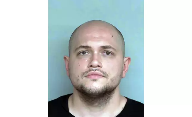 FILE - This undated booking photo provided by the Winona County, Minn., Detention Center shows Adam Fravel. (Winona County Detention Center via AP, File)