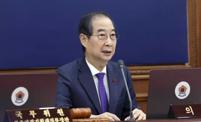 South Korea's Prime Minister Han Duck-soo, who became the country's acting leader after President Yoon Suk Yeol's impeachment, speaks during a cabinet meeting at the government complex in Seoul, South Korea, Tuesday, Dec. 17, 2024. (Hong Hae-in/Yonhap via AP)