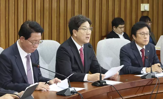 Kweon Seong-dong, center, floor leader of ruling People Power Party, speaks during a party's meeting at the National Assembly in Seoul, South Korea, Tuesday, Dec. 17, 2024. (Kim Ju-hyung/Yonhap via AP)