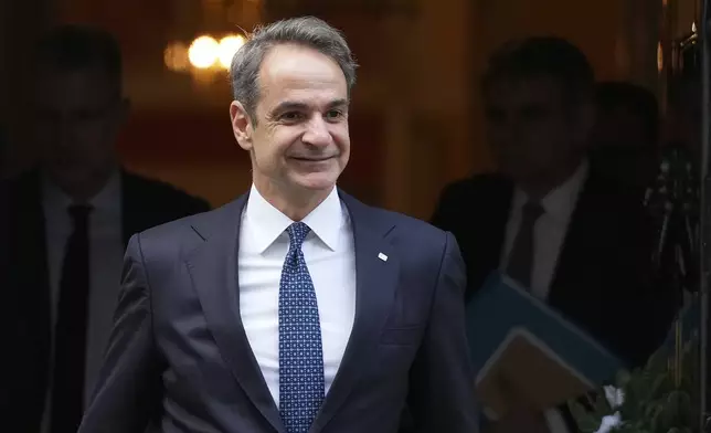 Greek Prime Minister Kyriakos Mitsotakis leaves 10 Downing Street after meeting Britain's Prime Minister Keir Starmer in London, Tuesday, Dec. 3, 2024. (AP Photo/Kirsty Wigglesworth)