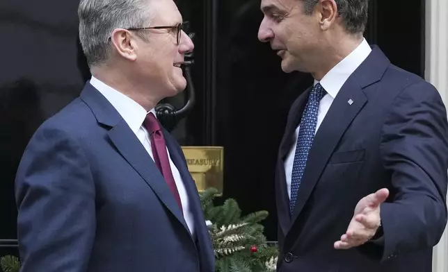 Britain's Prime Minister Keir Starmer welcomes his Greek counterpart Kyriakos Mitsotakis to 10 Downing Street in London, Tuesday, Dec. 3, 2024. (AP Photo/Kirsty Wigglesworth)