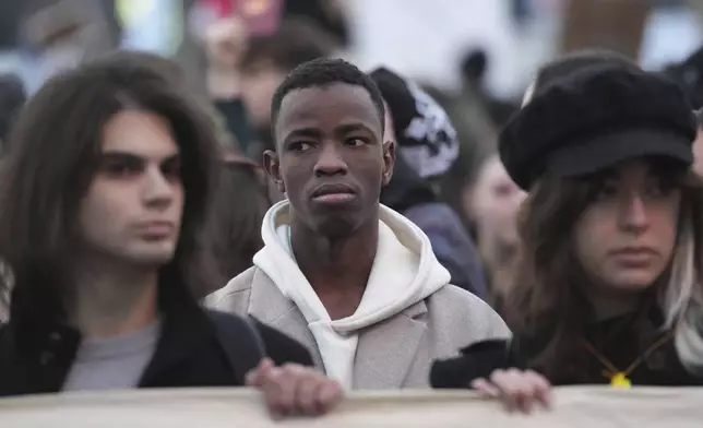 People attend a protest against the Serbian authorities in Belgrade, Serbia, Sunday, Dec. 22, 2024. (AP Photo/Darko Vojinovic)