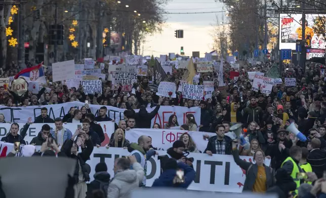 People attend a protest against President Aleksandar Vucic and his government, in central Belgrade, Serbia, Sunday, Dec. 22, 2024. (AP Photo/Marko Drobnjakovic)