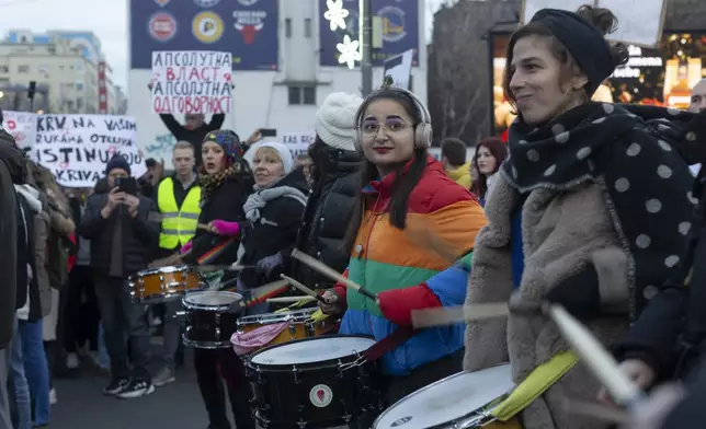 Students bang drums during a protest against populist President Aleksandar Vucic and his government, in Belgrade, Serbia, Sunday, Dec. 22, 2024. (AP Photo/Marko Drobnjakovic)