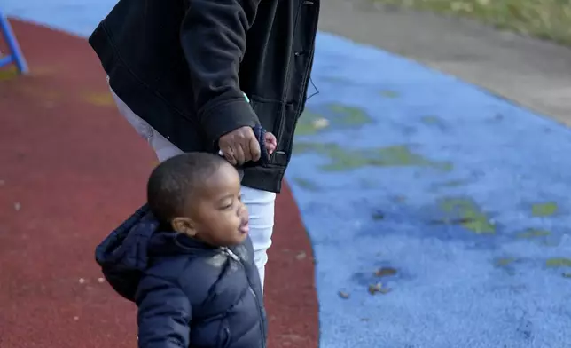 Anika Chillis, left, spends time with her son, Makhi, 2, at a playground Monday, Dec. 2, 2024, in Memphis, Tenn. (AP Photo/George Walker IV)