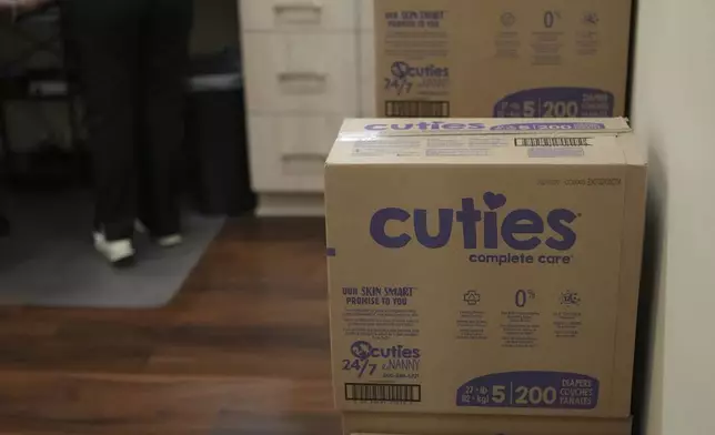 Boxes of diapers are stacked at the Pharmalife Community Pharmacy, Monday, Dec. 9, 2024, in Murfreesboro, Tenn. The business provides diapers free of charge to customers who qualify through the state's TennCare Diaper Benefit. (AP Photo/George Walker IV)