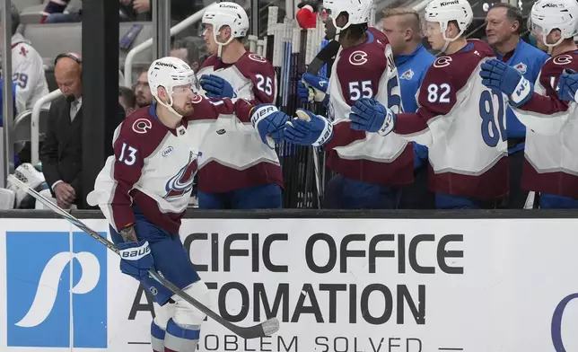 Colorado Avalanche right wing Valeri Nichushkin (13) is congratulated by teammates after scoring against the San Jose Sharks during the first period of an NHL hockey game in San Jose, Calif., Thursday, Dec. 19, 2024. (AP Photo/Jeff Chiu)