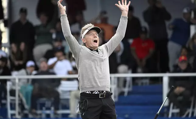 Bernhard Langer reacts after making a putt during a playoff hole on the 18th green to win the PNC Championship golf tournament, Sunday, Dec. 22, 2024, in Orlando, Fla. (AP Photo/Phelan M. Ebenhack)