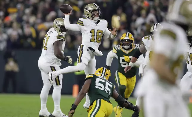 New Orleans Saints quarterback Spencer Rattler (18) passes during the second half of an NFL football game against the Green Bay Packers, Monday, Dec. 23, 2024, in Green Bay, Wis. (AP Photo/Matt Ludtke)