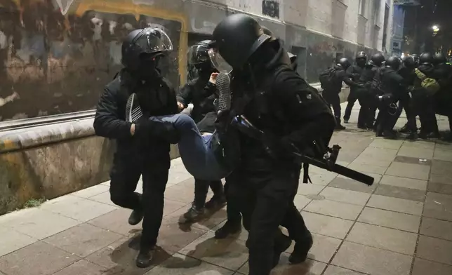 Police detain demonstrators during a protest against the government's decision to suspend negotiations on joining the European Union in Tbilisi, Georgia, on Tuesday, Dec. 3, 2024. (AP Photo/Zurab Tsertsvadze)