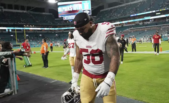 San Francisco 49ers defensive tackle Khalil Davis (50) leaves the field at the end of an NFL football game against the Miami Dolphins, Sunday, Dec. 22, 2024, in Miami Gardens, Fla. (AP Photo/Lynne Sladky)